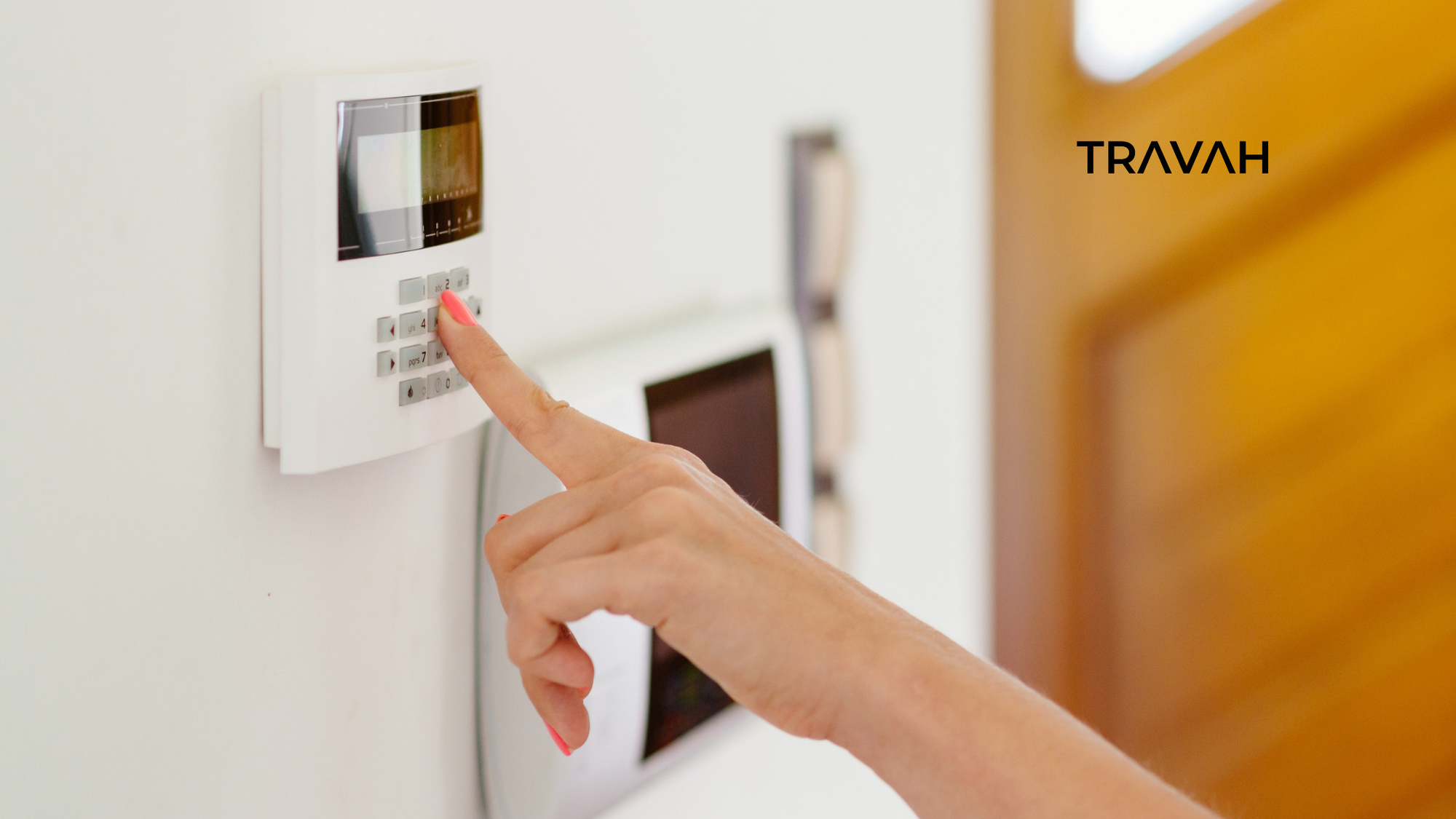 hand pressing buttons on alarm security system in house